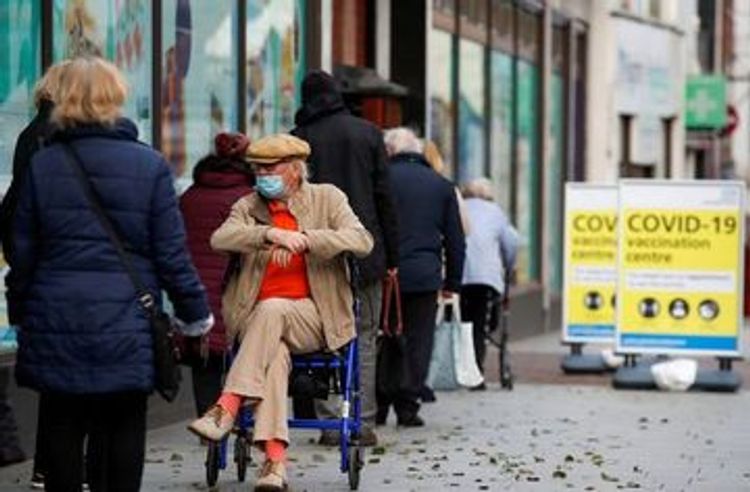 Nearing vaccine target, Britain offers COVID shots to more people