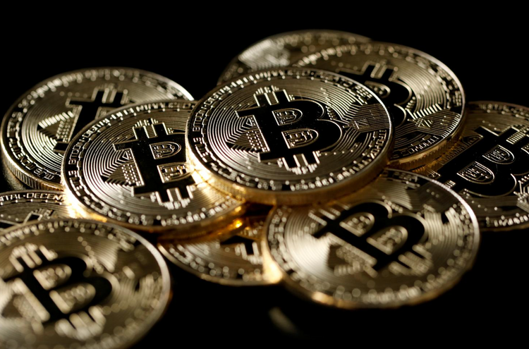 Bitcoin nears $50,000, wider adoption fuels record rally