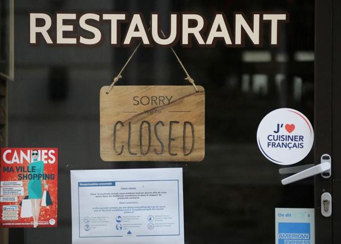 Euro zone fourth quarter GDP falls less than earlier estimated