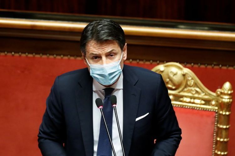 Italy PM wins backing for deficit hike after surviving coalition ambush