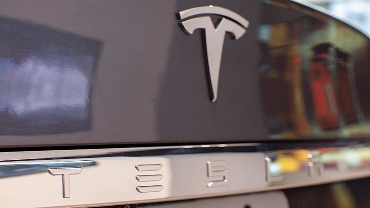 Tesla posts record quarterly revenue of over $10 bln.