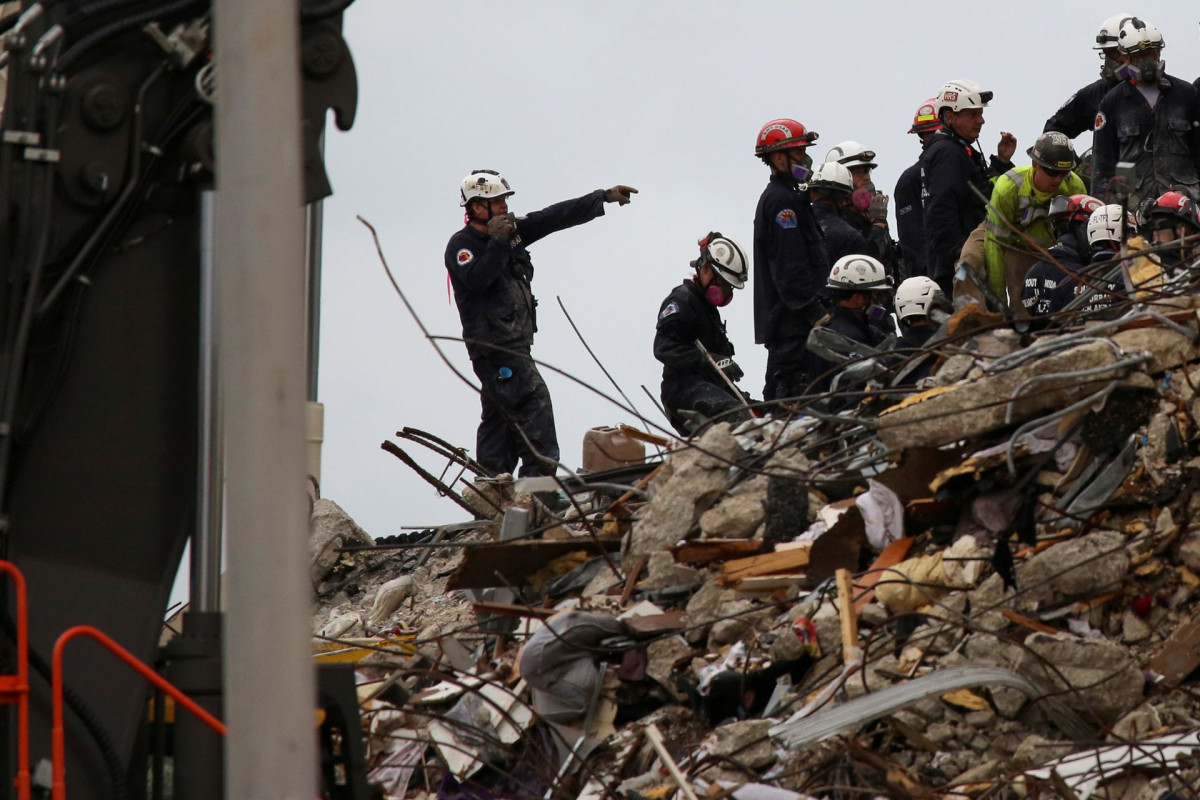Death toll in Florida condo collapse at 20, firefighter's daughter among the dead