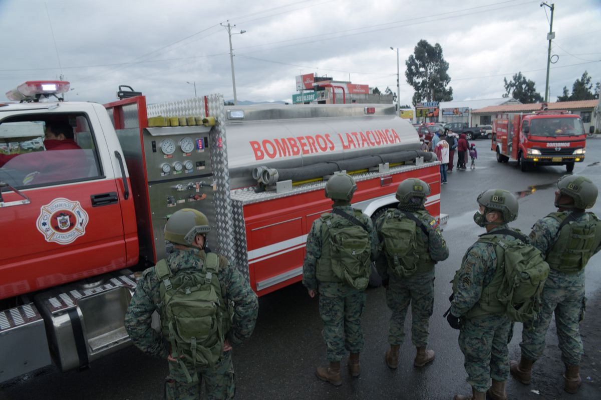Ecuador says at least 18 inmates die in two prison riots