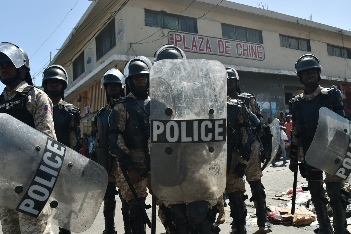 Gangs raid police stations for weapons in Haiti as deadly violence surges