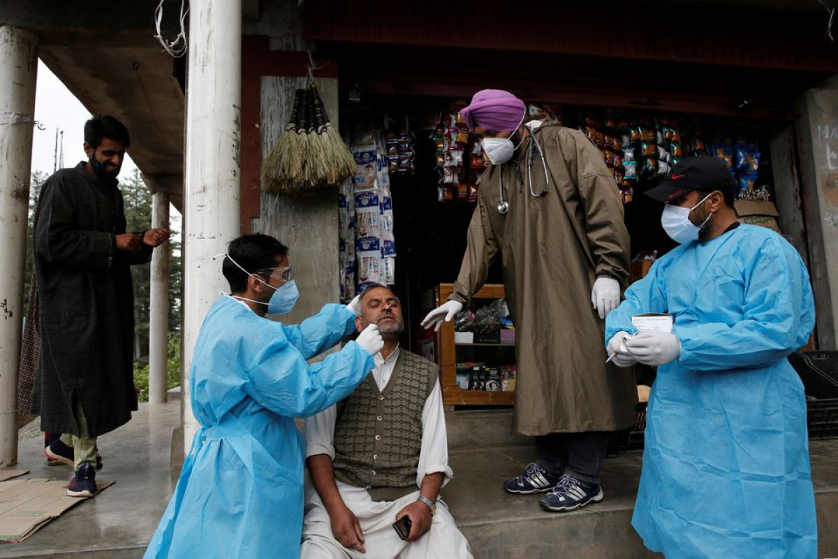 India reports 67,208 new COVID-19 cases, 2,330 deaths