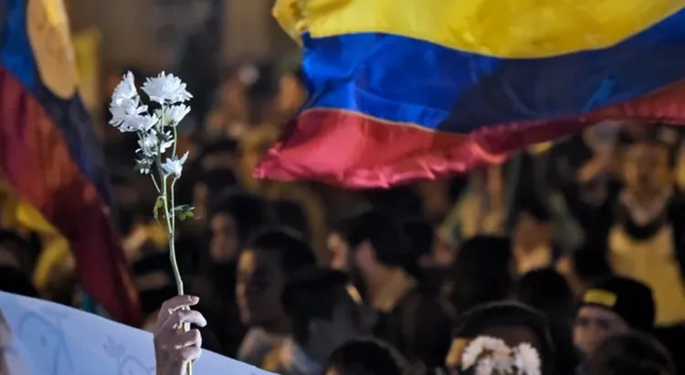 Thousands march in Colombia in fourth day of protests against tax plan