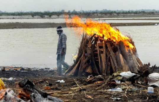 Dozens of bodies wash up on river bank in India