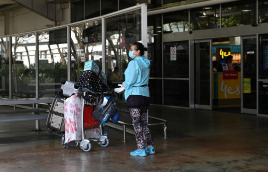 Australia sticks by plan to re-open border in mid-2022