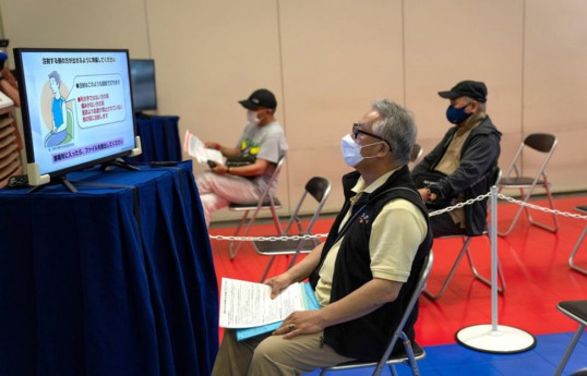 Japan opens mass vaccination sites for elderly ahead of Olympics