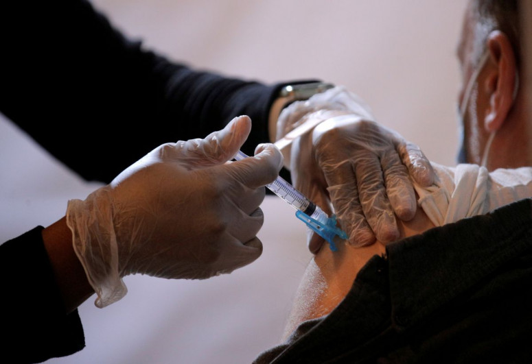More than half of American adults vaccinated as COVID cases ebb