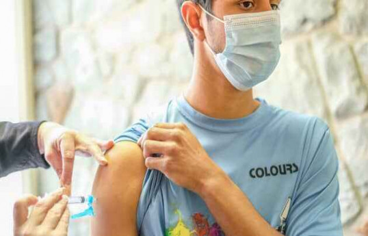 Moderna says its Covid vaccine is 100% effective in teens, plans to seek FDA OK in early June
