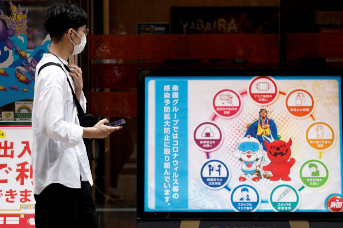 Japan prepares beds, booster shots in COVID-19 lull before winter