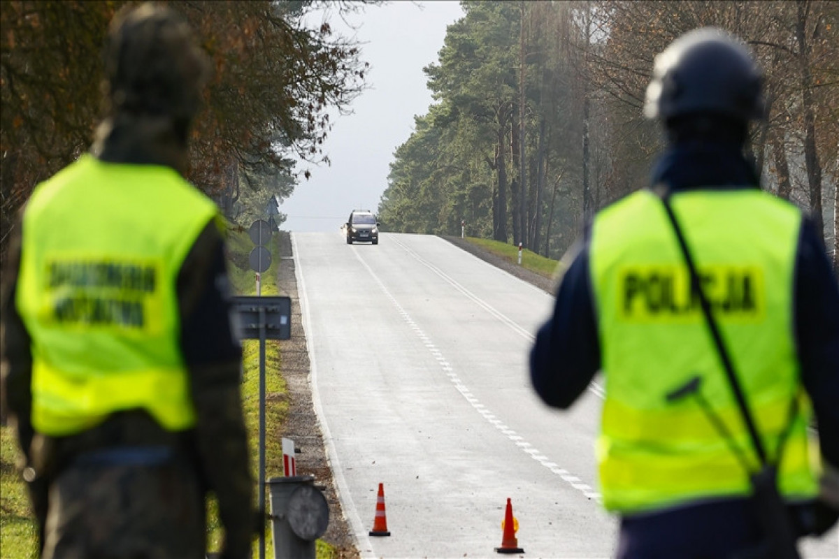 Poland detains 100 migrants after they cross Belarus' border