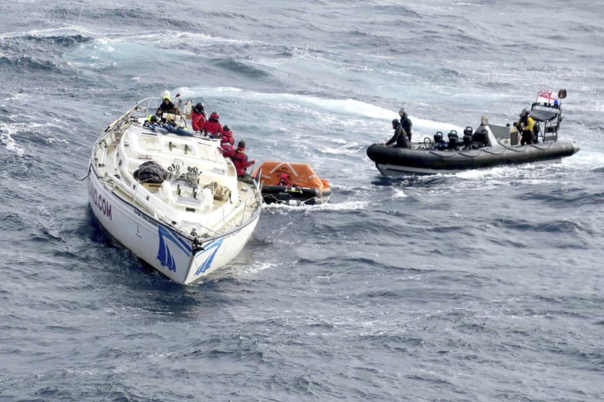 Responders rescue 14 from waters off Spain