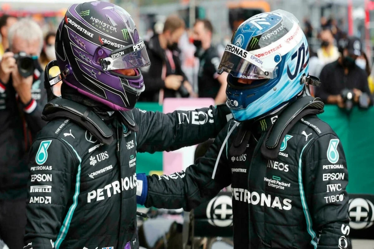 Lewis Hamilton and Mercedes' Finnish driver Valtteri Bottas after qualifying