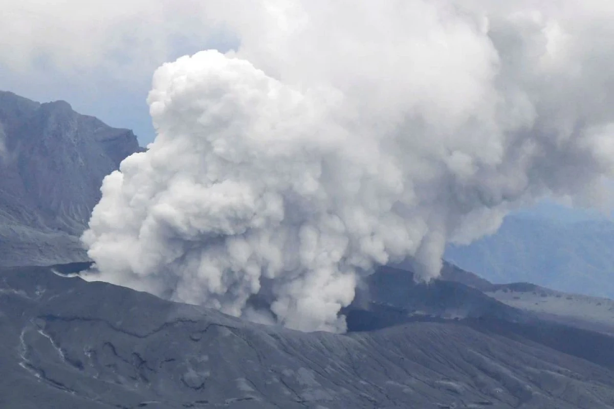 Japanese volcano spews plumes of ash, people warned away