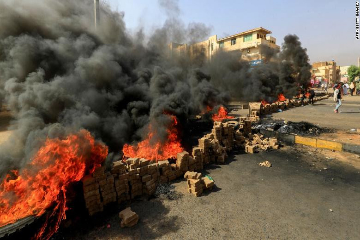 Crowds rally as Sudan PM held in apparent army coup; gunfire reported