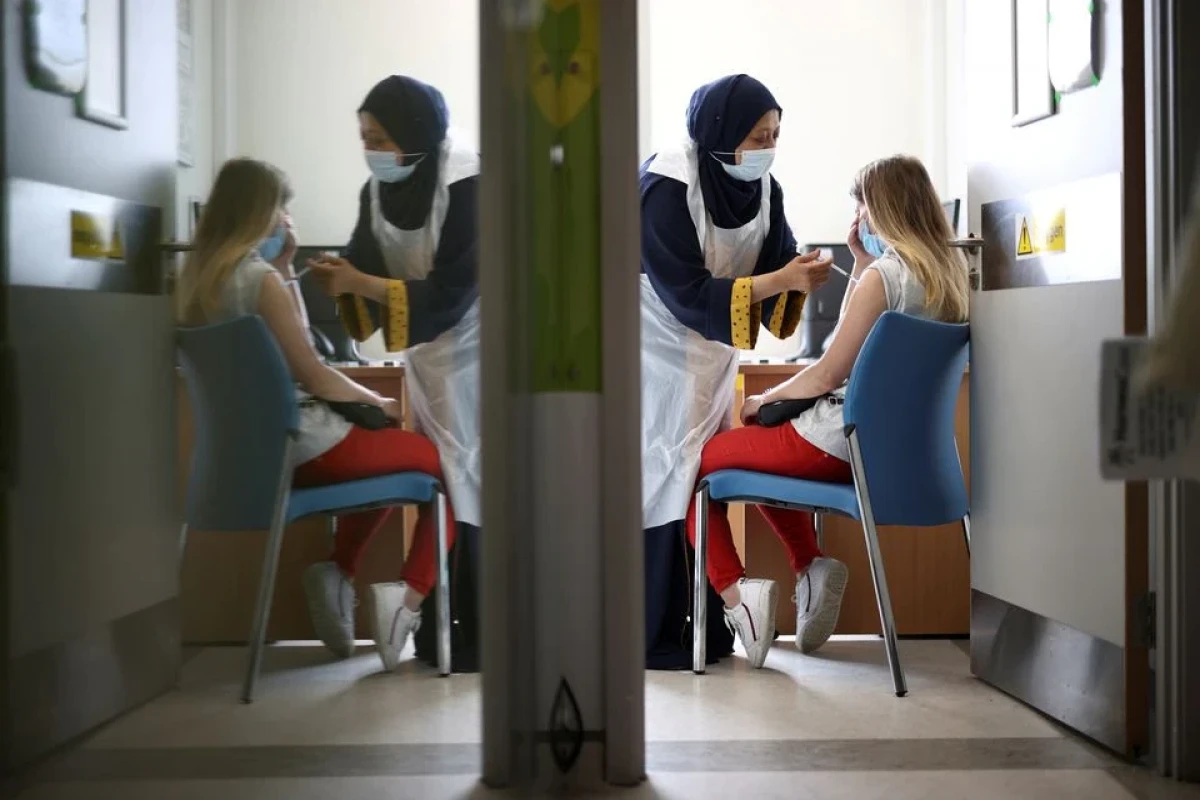 UK plans COVID boosters for over 50s to cope with "bumpy" winter