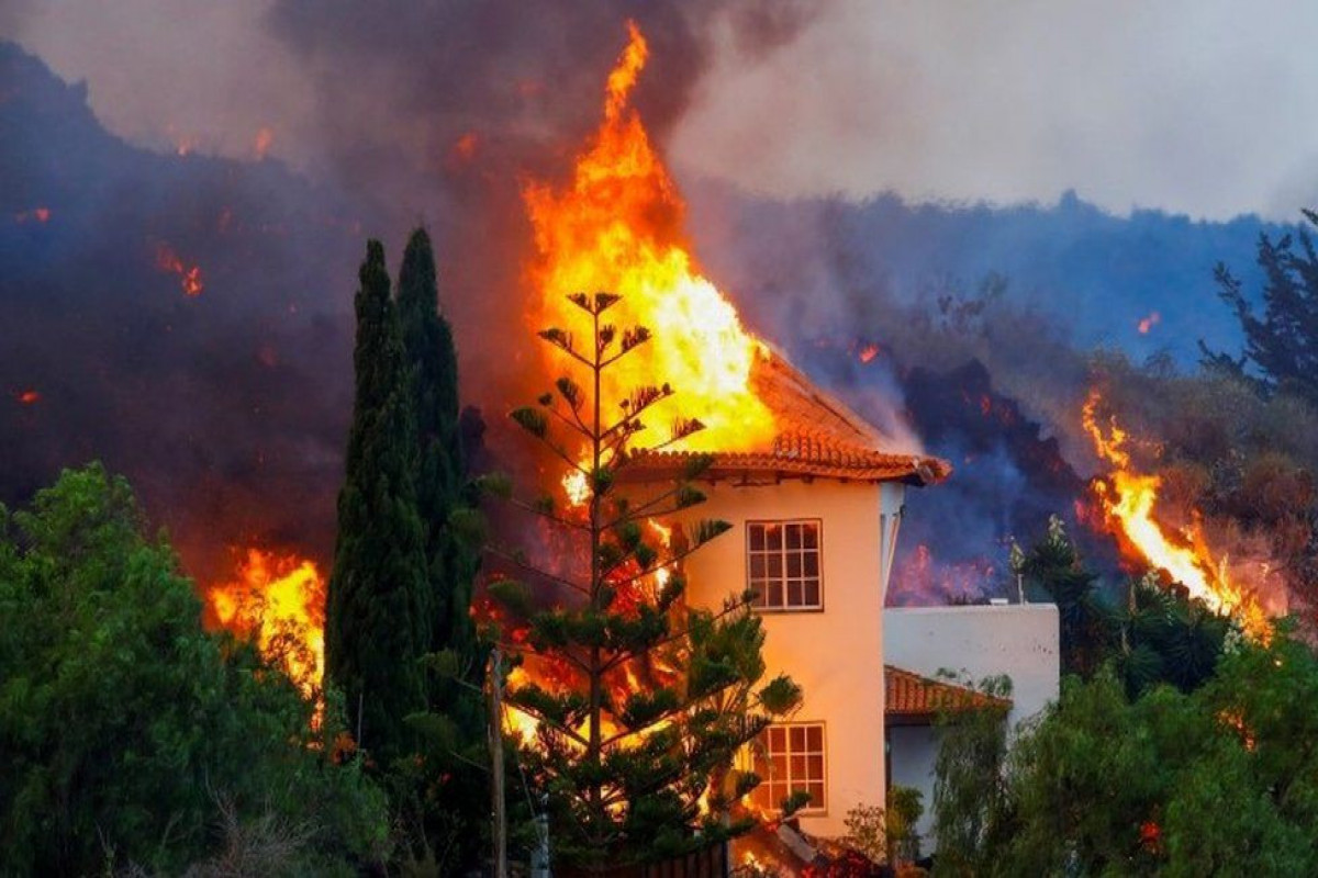 Lava from erupting volcano destroys homes in Canary Islands
