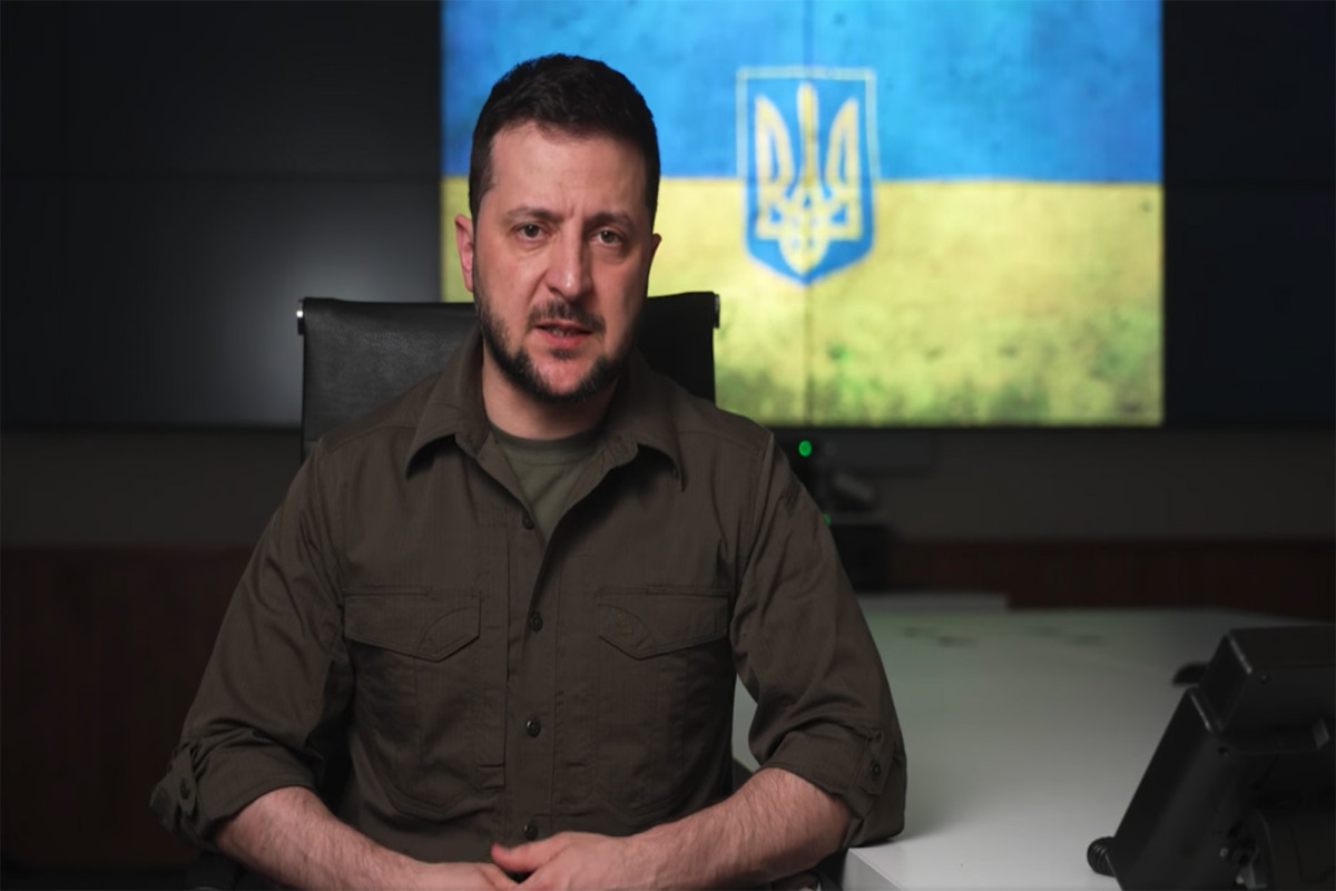 Ukrainian President Volodymyr Zelensky speaks during a video broadcast on Friday evening April 8