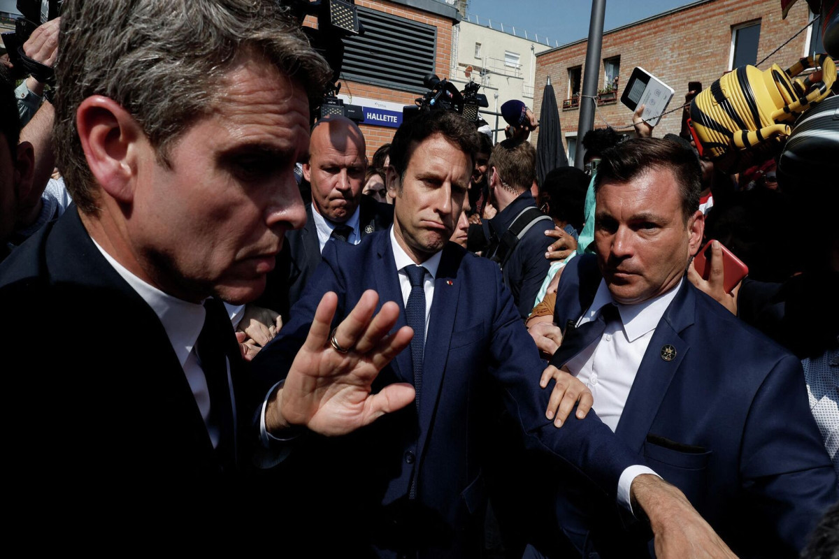 Macron pelted with tomatoes as French fury erupts at President just days after re-election-VIDEO 