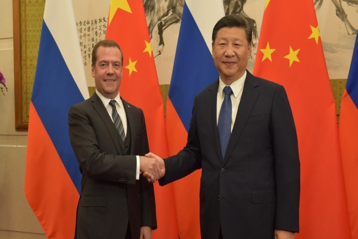 Xi Jinping, general secretary of the Communist Party of China and Chairman of the United Russia party Dmitry Medvedev