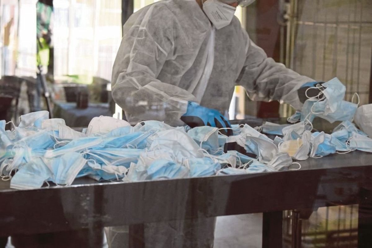 Tens of thousands of tonnes of Covid waste threatening health and environment, warns WHO