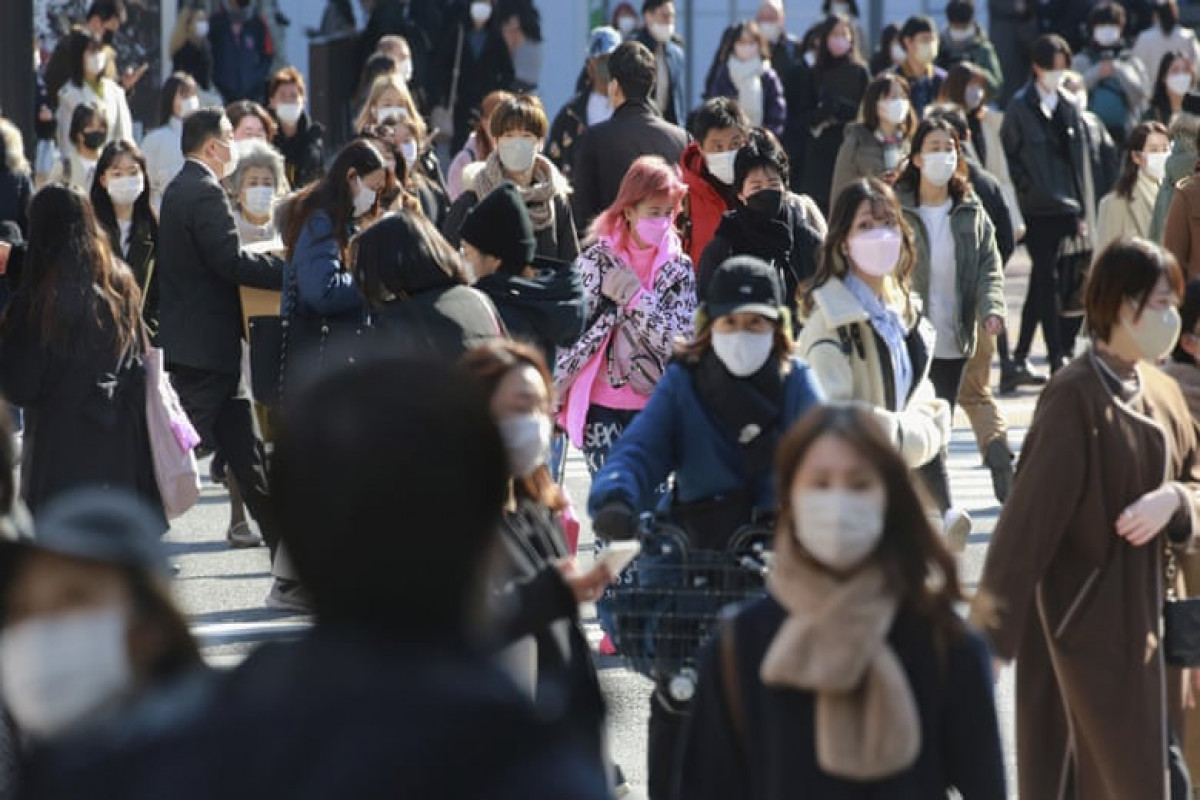 Japan cuts quarantine for Covid family members to 7 days