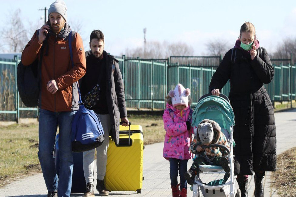 Germany vows to take in all Ukrainian refugees