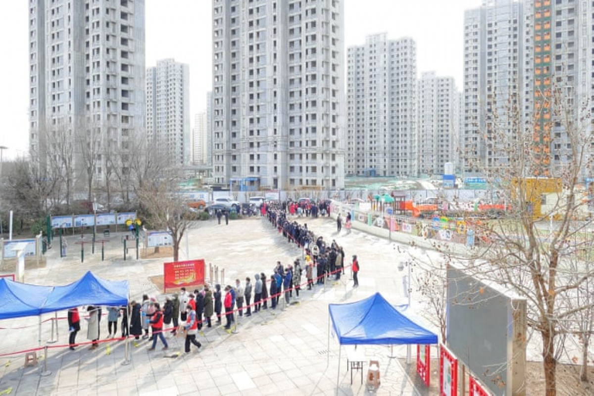 China detects more Omicron cases as cities tighten restrictions