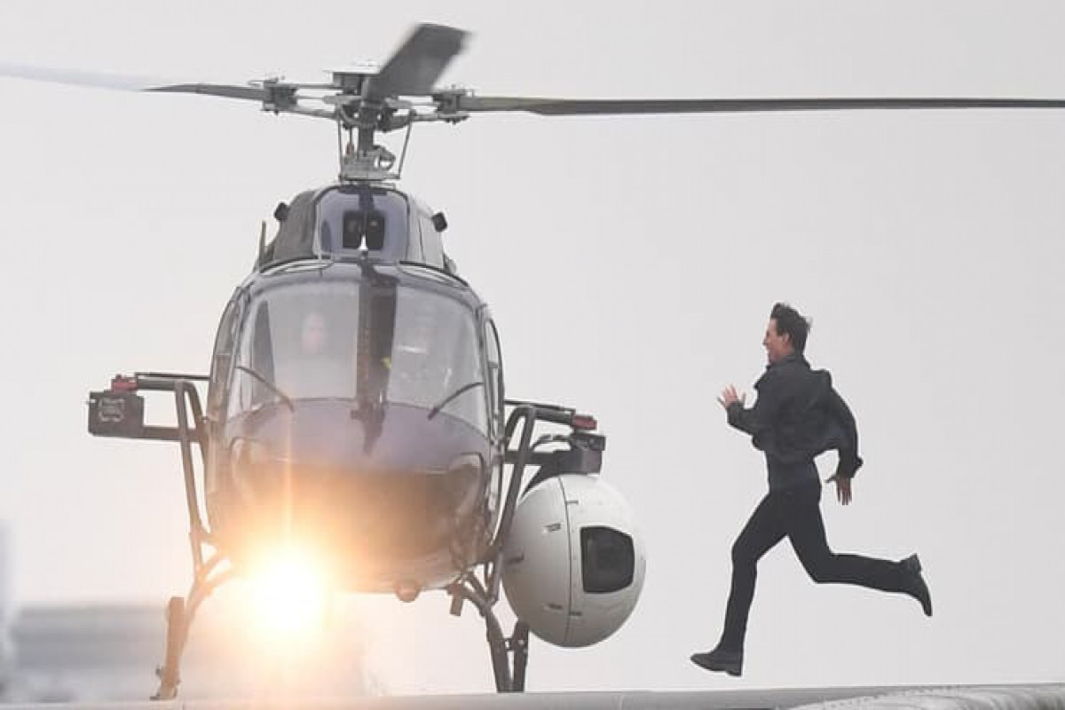 Tom Cruise runs along Blackfriars Bridge in London, during filming for “Mission Impossible 6.”