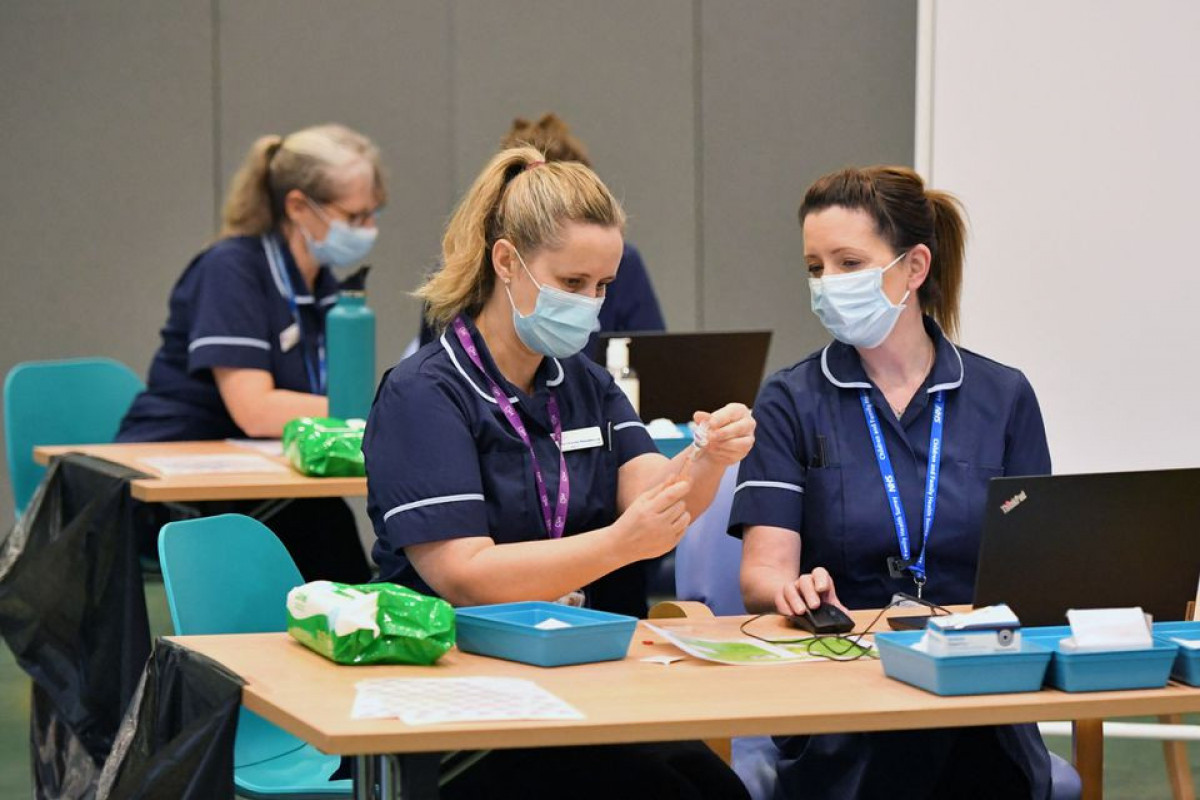 UK could change mandatory COVID vaccination for health staff - minister