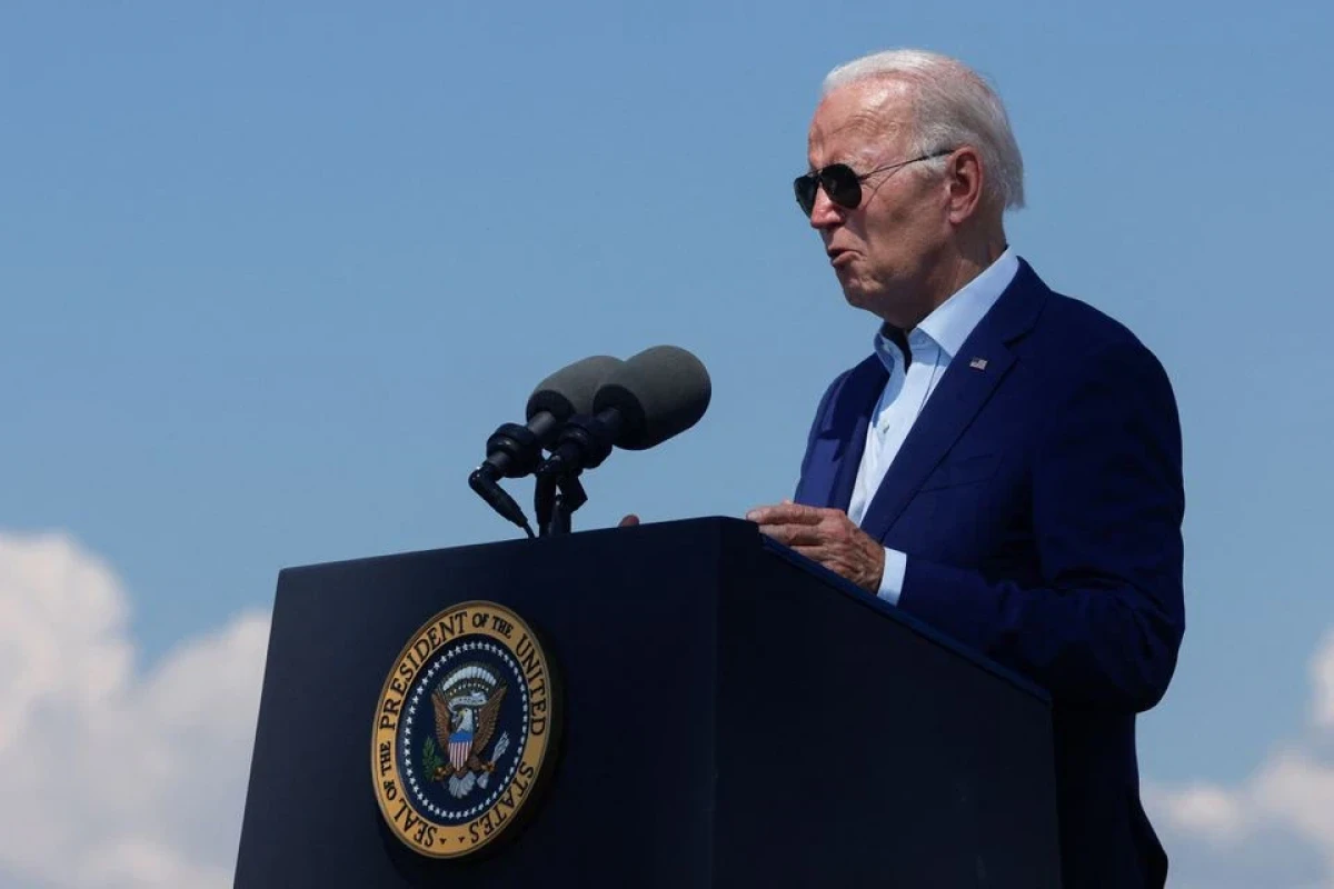 Biden stops short of declaring climate emergency, takes steps on wind power