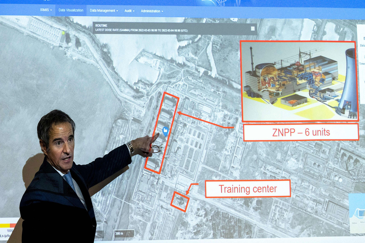 IAEA Director General Rafael Grossi points at a map of the Zaporizhzhia nuclear power plant during a press conference in Vienna, Austria, on March 4