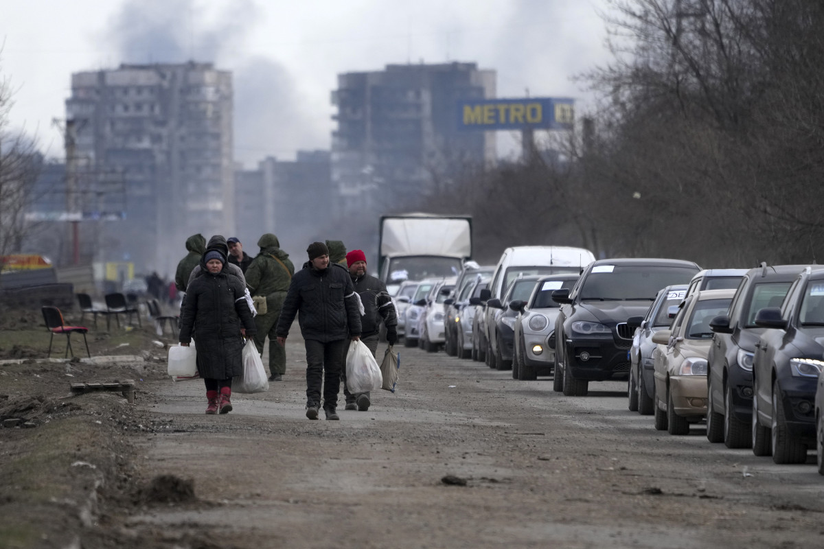Citizens evacuate Mariupol, Ukraine, on Sunday, March 20