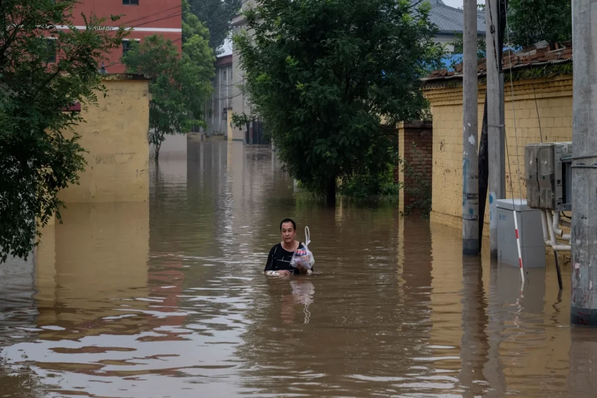 More than a million displaced and dozens dead after record rain drenches northeastern China