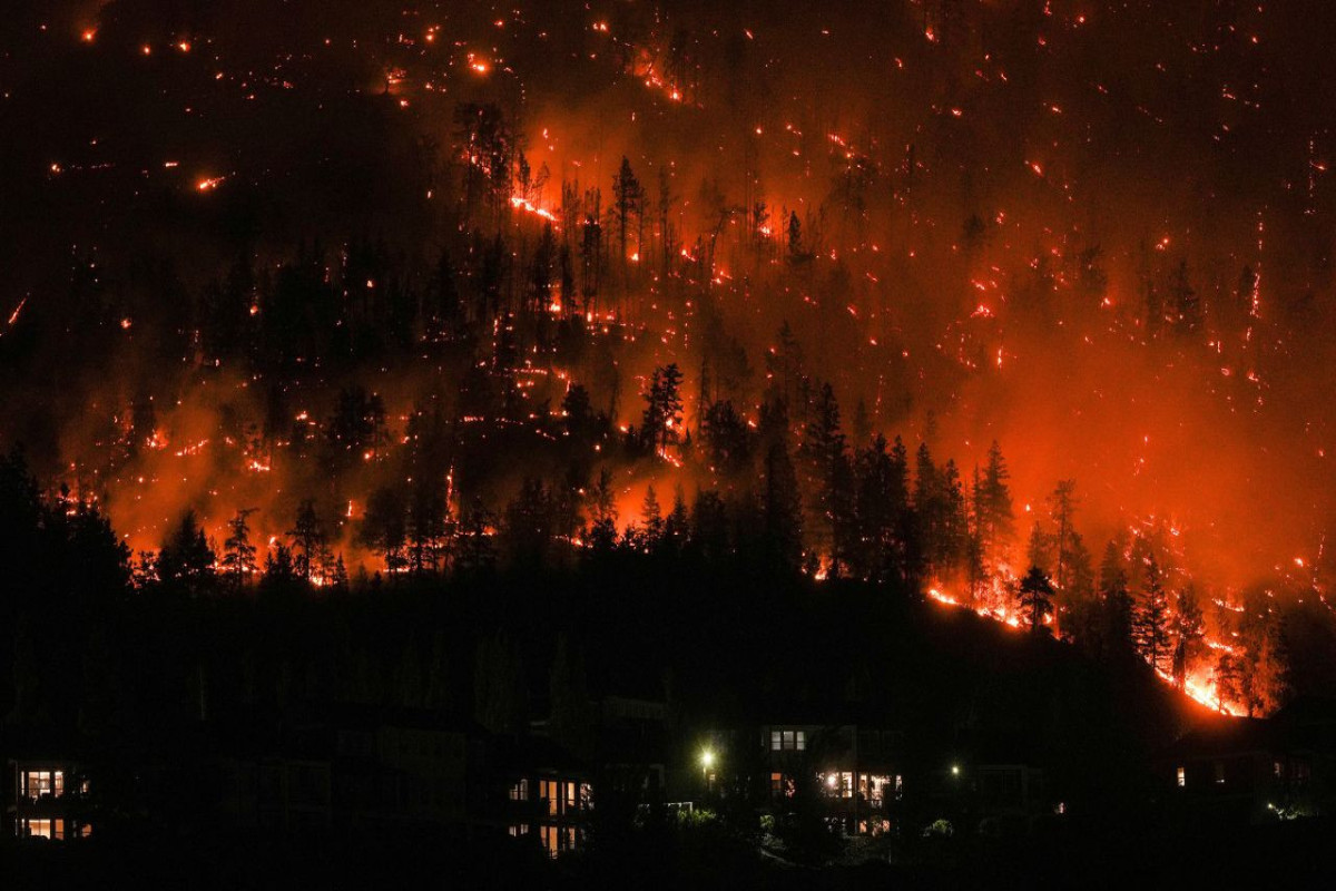 Wildfires threaten western Canada city as far north evacuated