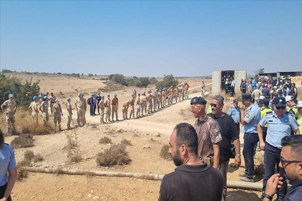 Northern Cypriot police say 8 officers injured in melee with UN peacekeepers
