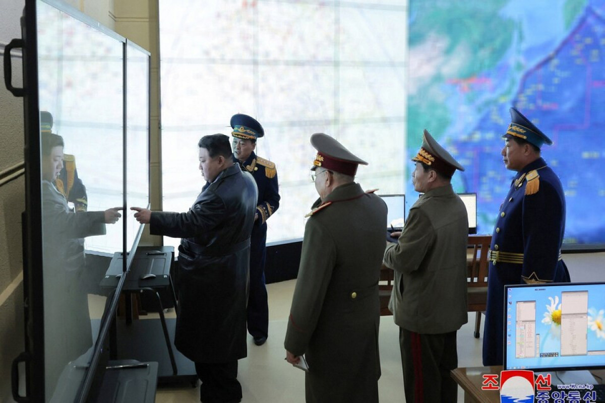Kim Jong-un inspects 'dazzling new era' of aircraft on Aviation Day holiday