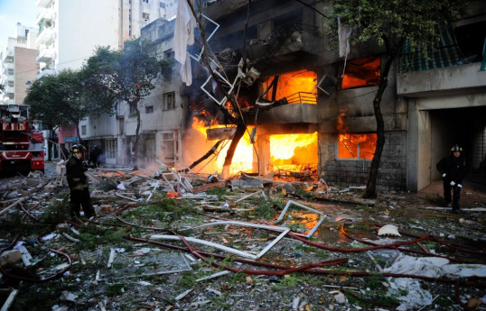 1 killed, dozens injured after fire burns downtown building in Argentina