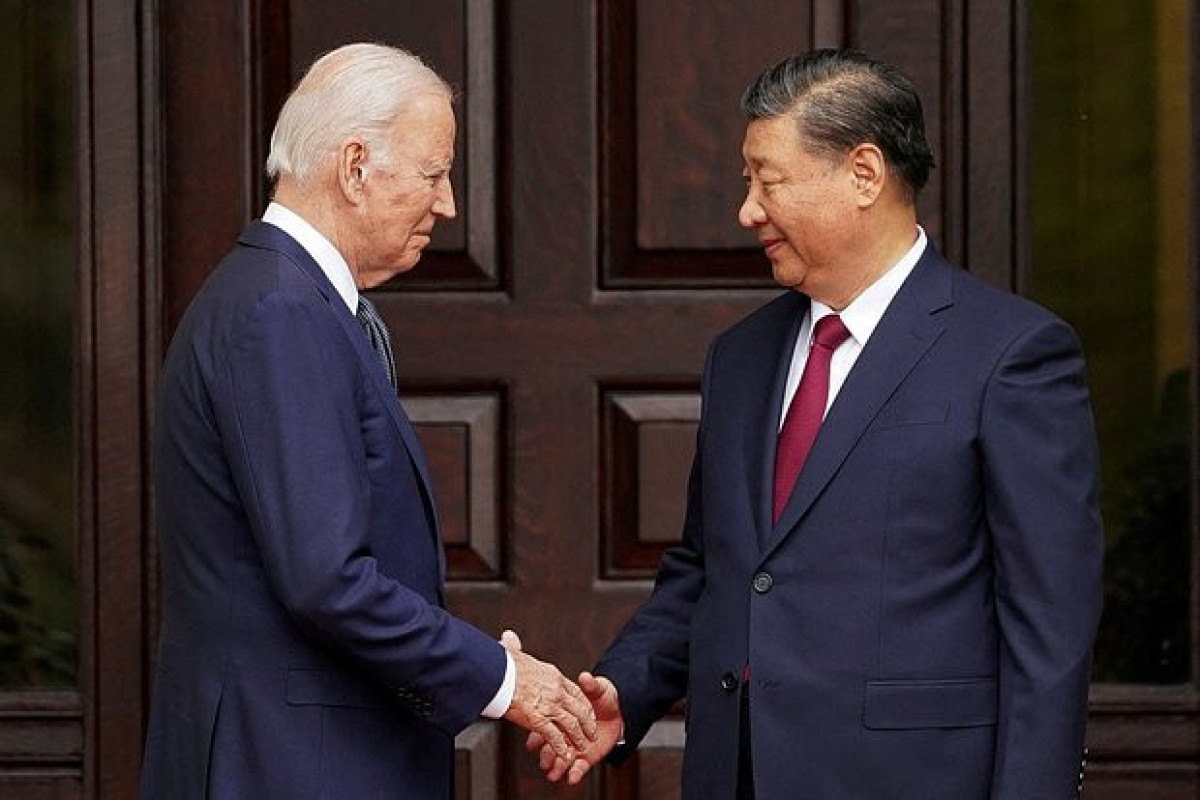 Xi told Biden at summit that China plans to reunify with Taiwan