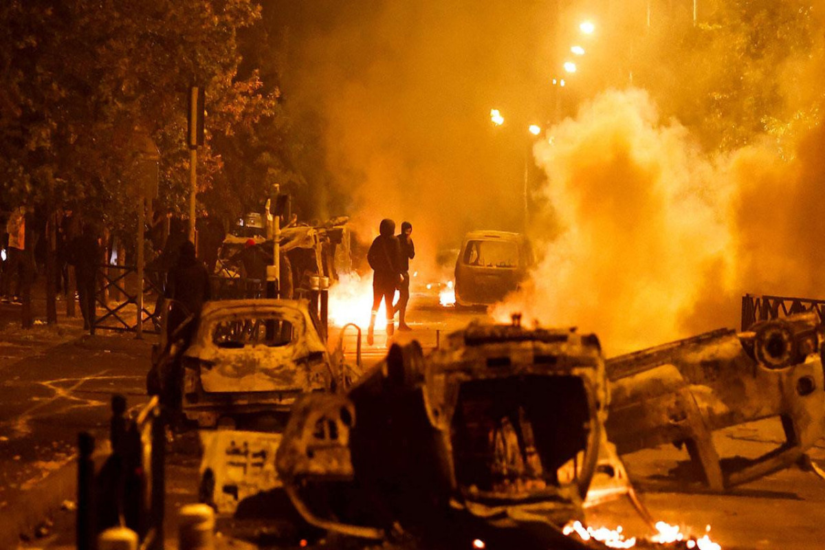 Fires rage as police detain more than 1,300 on fourth night of French protests