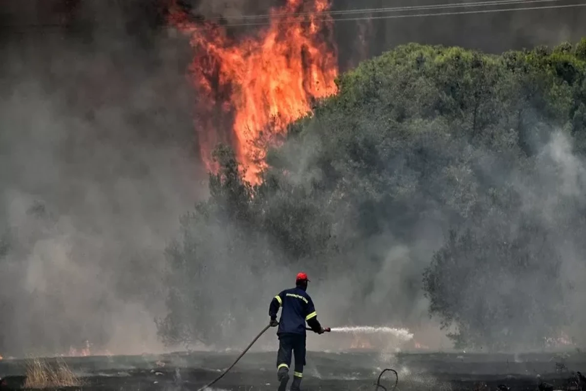 Wildfires intensify in Greece as temperatures soar