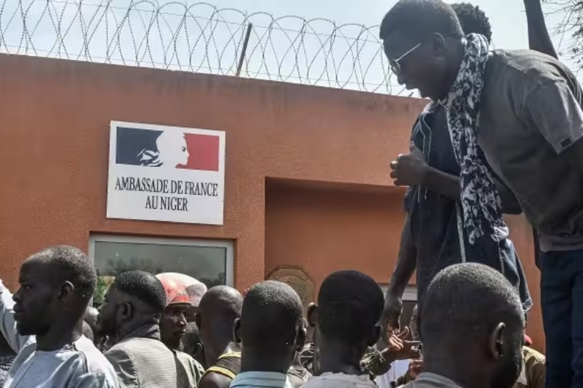 West Africa threatens force on Niger coup leaders, French embassy attacked