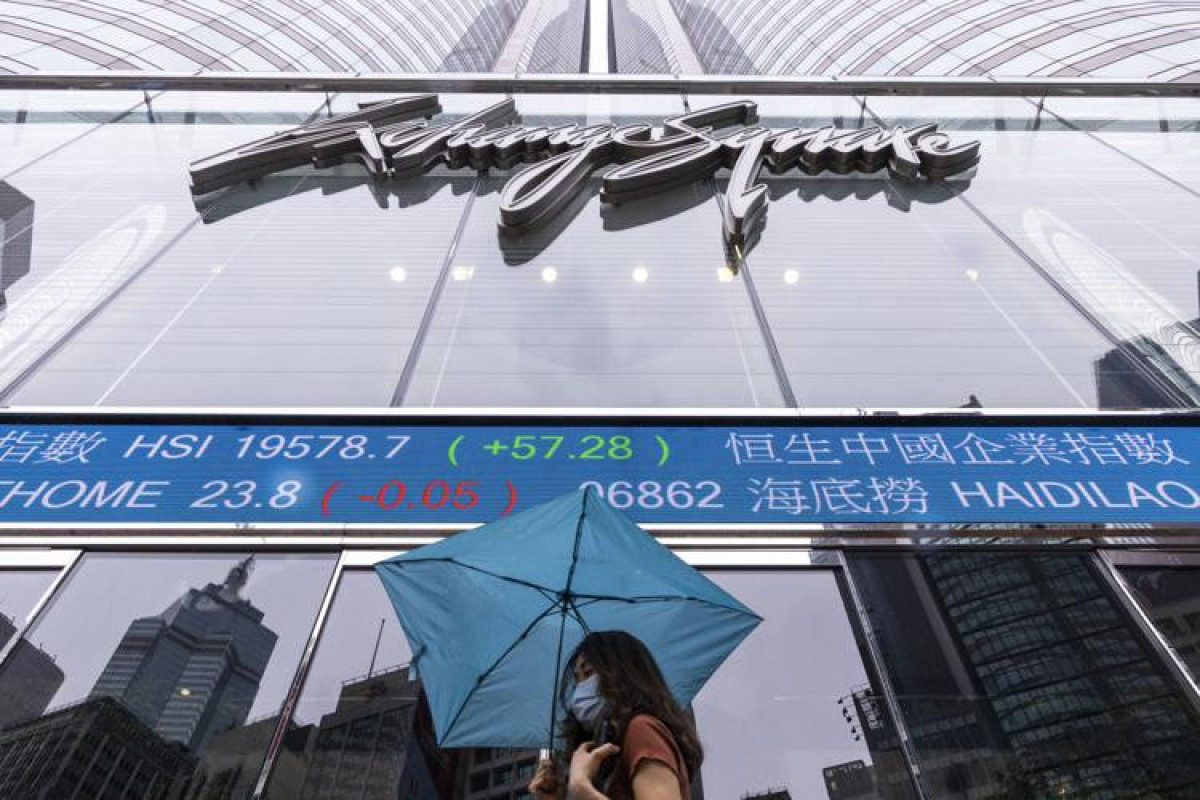 Stocks close mixed after Fed pauses rates and hints at more hikes to come