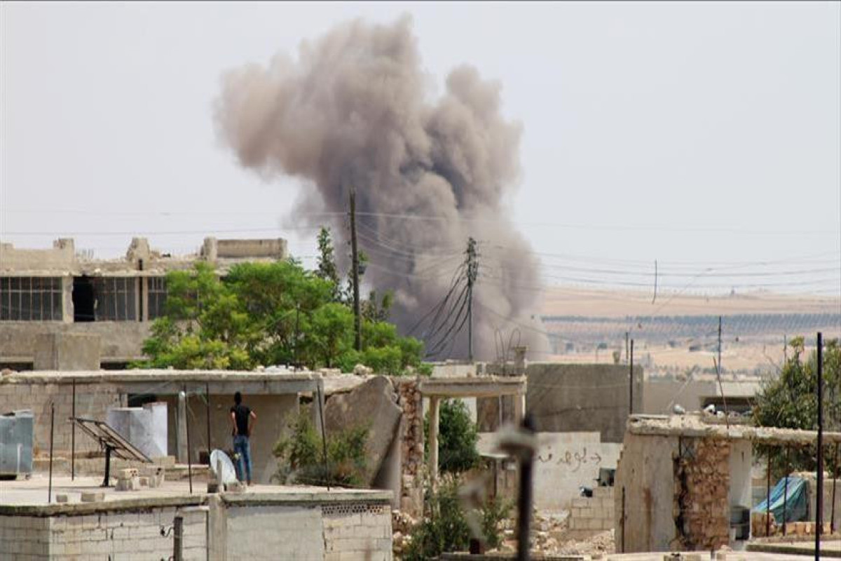 Airstrike hits busy market in opposition-held northwestern Syria and kills at least 9 people