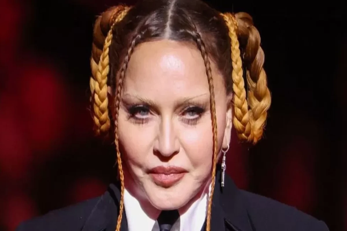 Madonna postpones tour after stay in intensive care