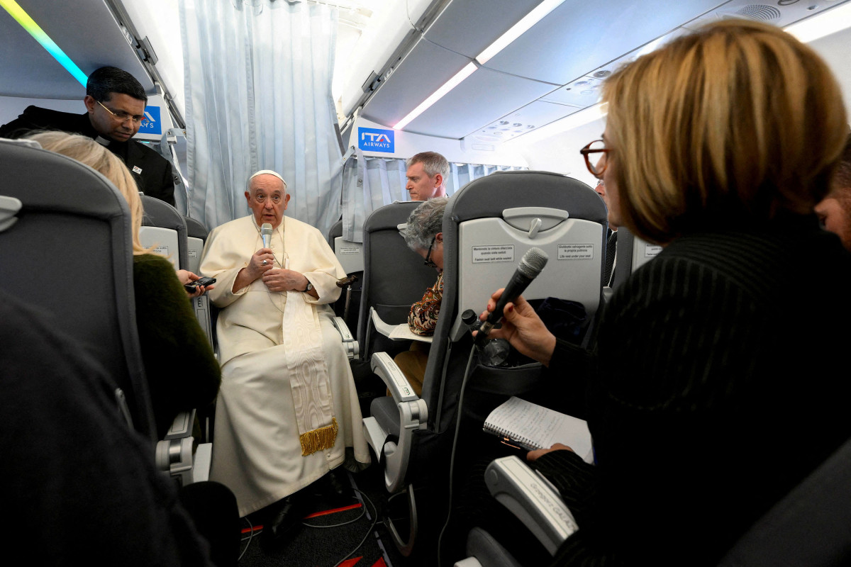 Pope Francis holds a news conference aboard a plane heading back to the Vatican from Hungary
