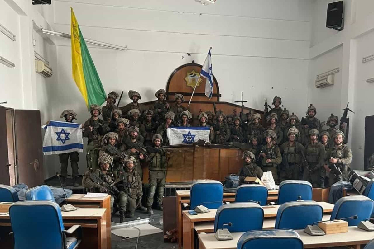 IDF troops take over Gaza’s parliament building, film themselves with Israeli flags
