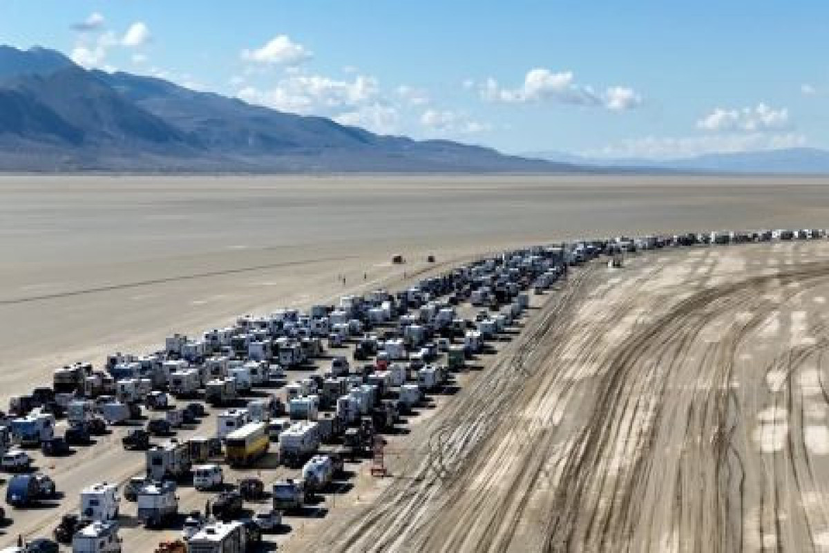 Burning Man festival road reopens, allowing thousands to escape muddy trap